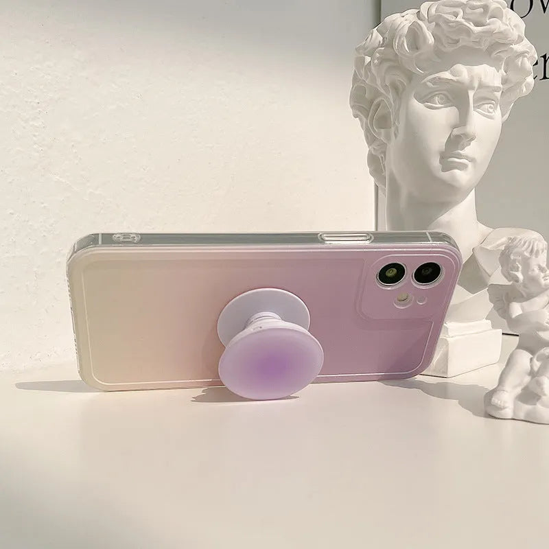 Yellow-purple gradient silicone iPhone case with retractable viewing bracket shown on mobile phone