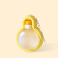Green portable dog water bottle with pull-out drinking bowl on grass, showing travel cup design.