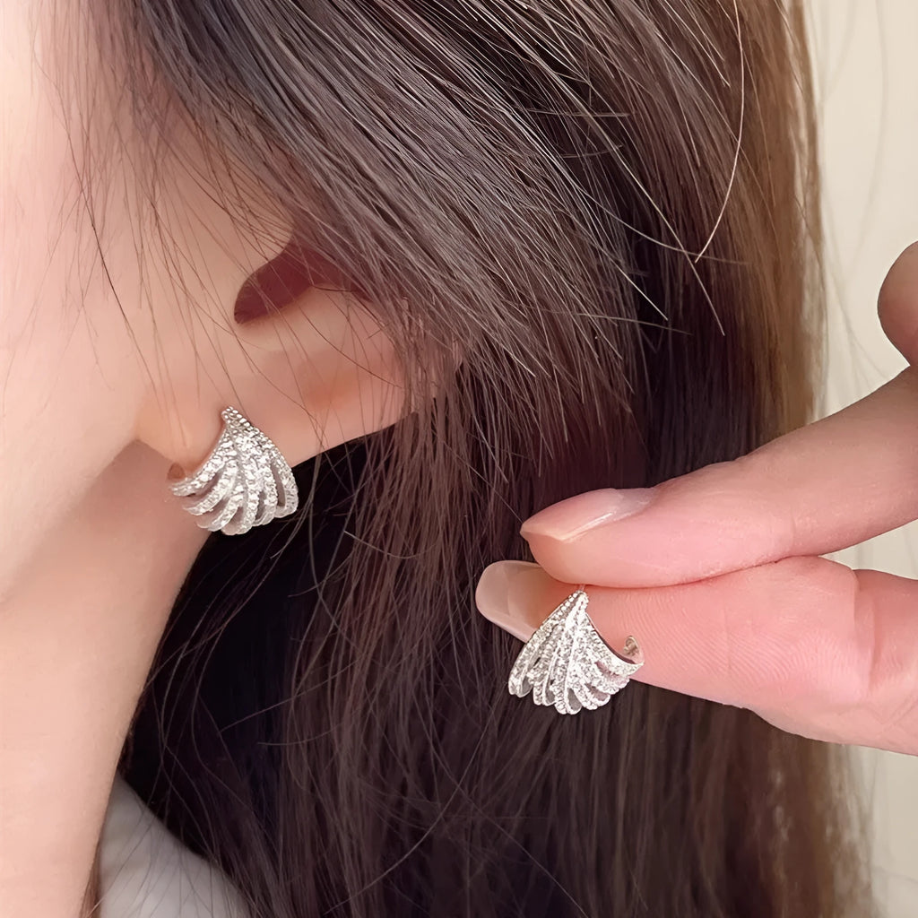 Women's geometric line design earrings with platinum electroplating and zircon construction