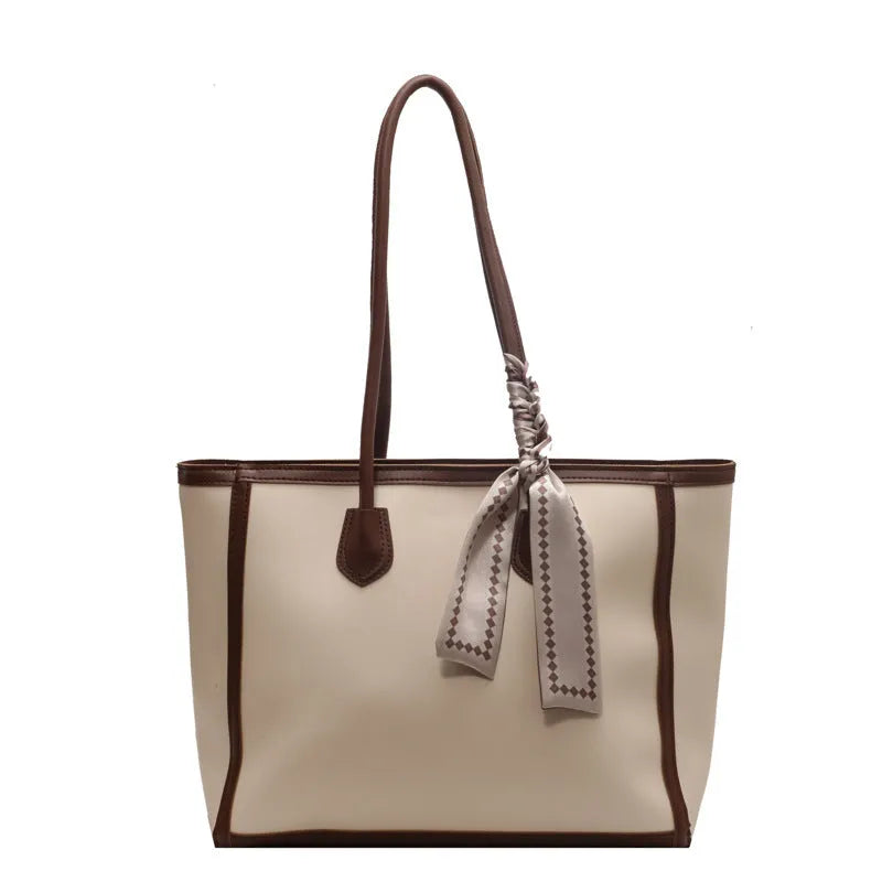 Soft PU leather square tote shoulder bag in black showing open outer pocket and internal phone compartment.
