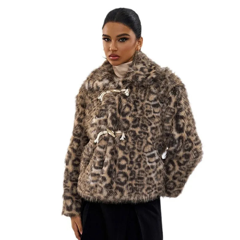 Women's leopard print coat with a buckle on the lapel.