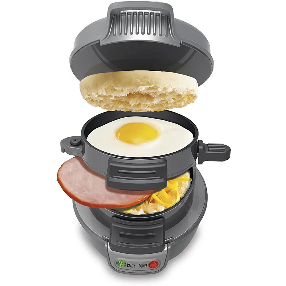 Bright red breakfast machine with egg cooker ring and sandwich plates on kitchen counter
