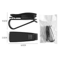 Black plastic clip mounted on a car sun visor holding a pair of sunglasses and an ID card.
