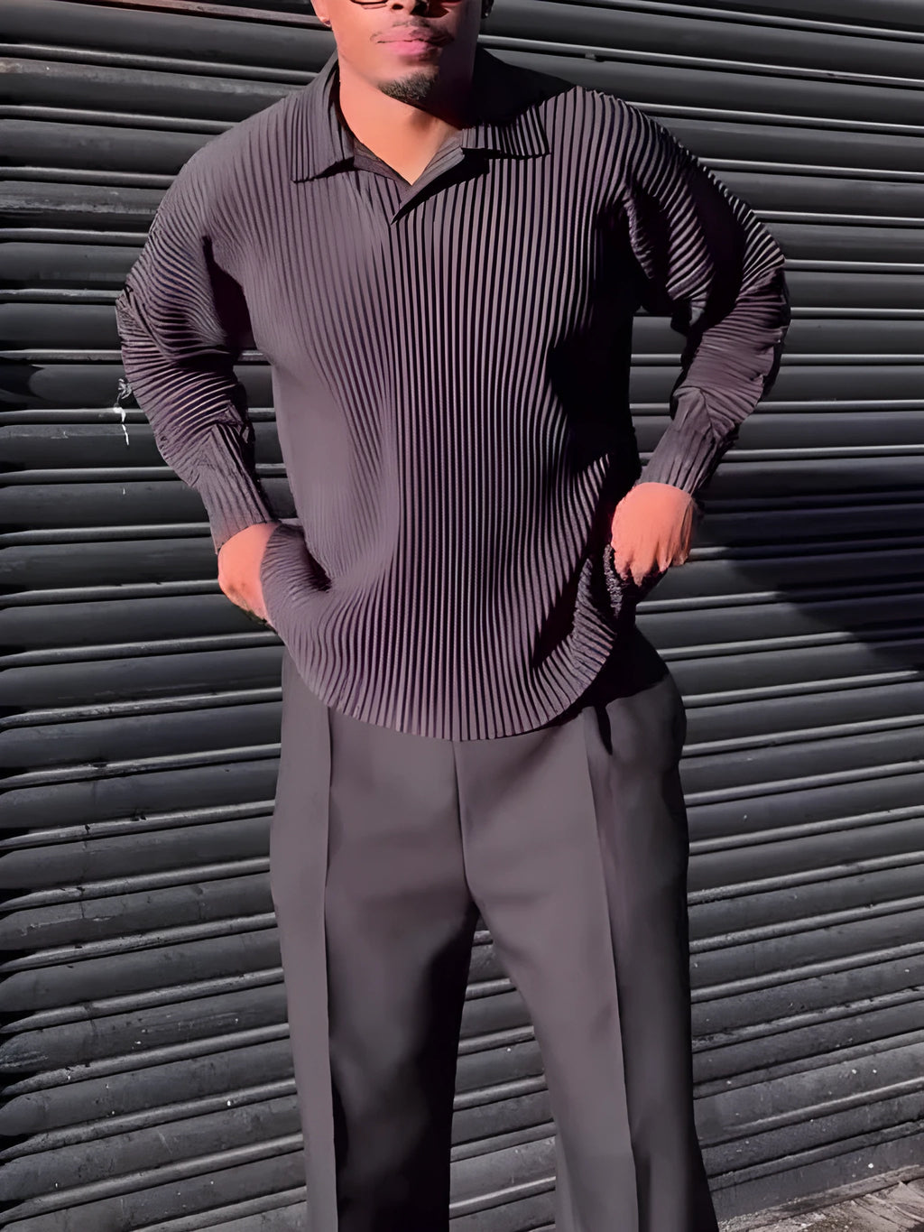 Men's black pleated long-sleeved casual top made from polyester, shown on a model.