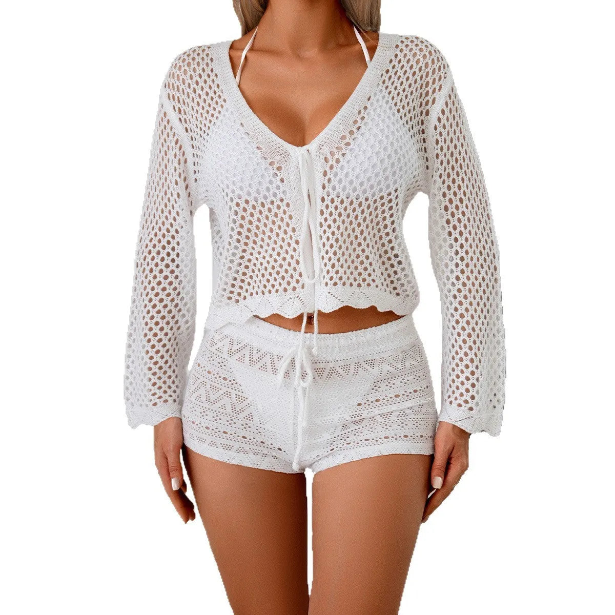 Short apricot hollow woven women's cardigan blouse with bell sleeves on a hanger