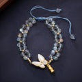 Handmade geometric woven bracelet for women with a grey moonstone and butterfly design.
