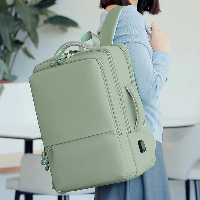 Green waterproof Oxford cloth backpack with 35 litre capacity and air pillow straps