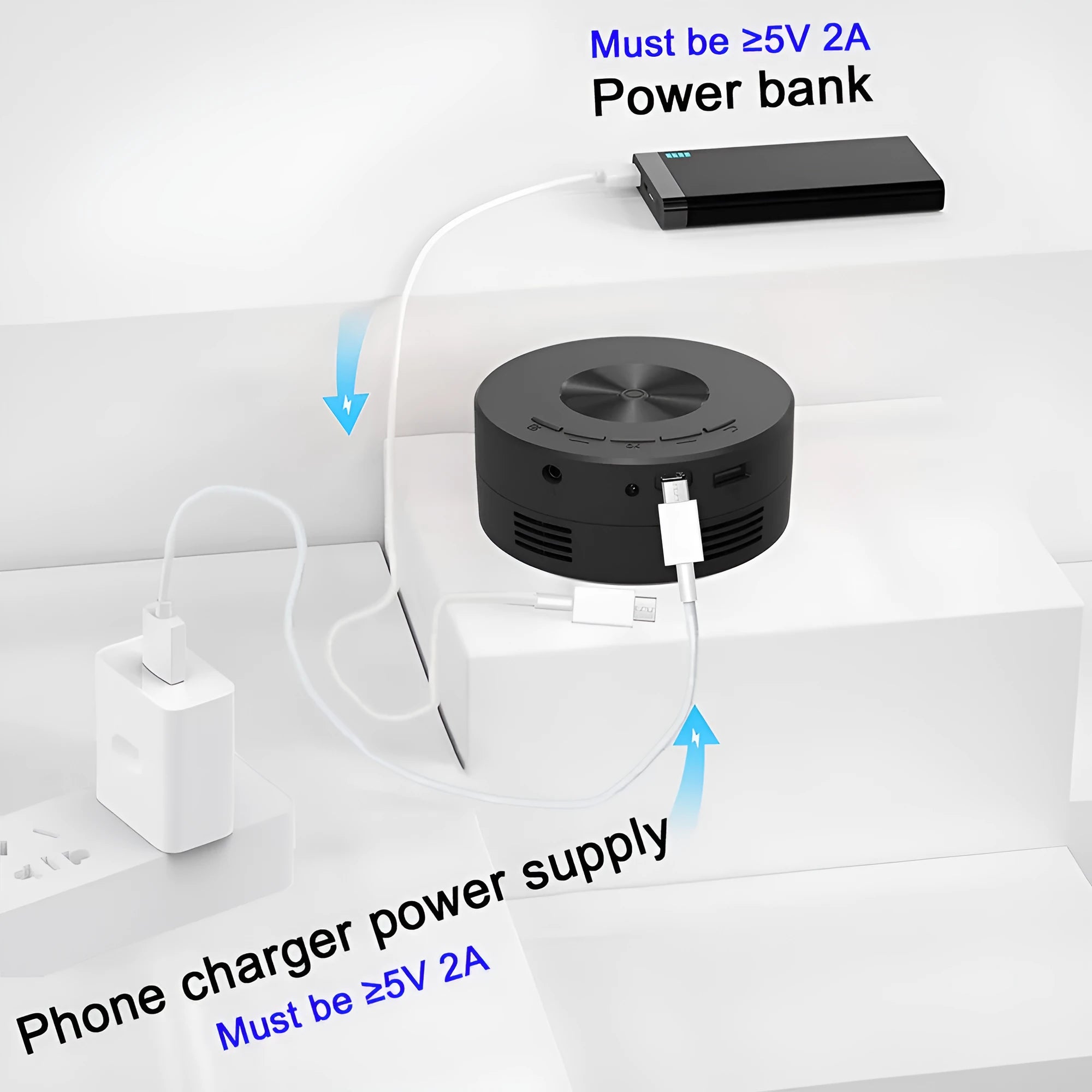 Black portable children's home projector for mobile phone connection on a surface