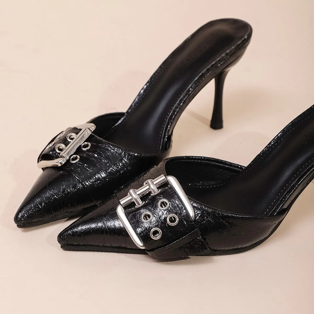 Black women's high heel shoes with pointed toe, ankle strap, and buckle decoration