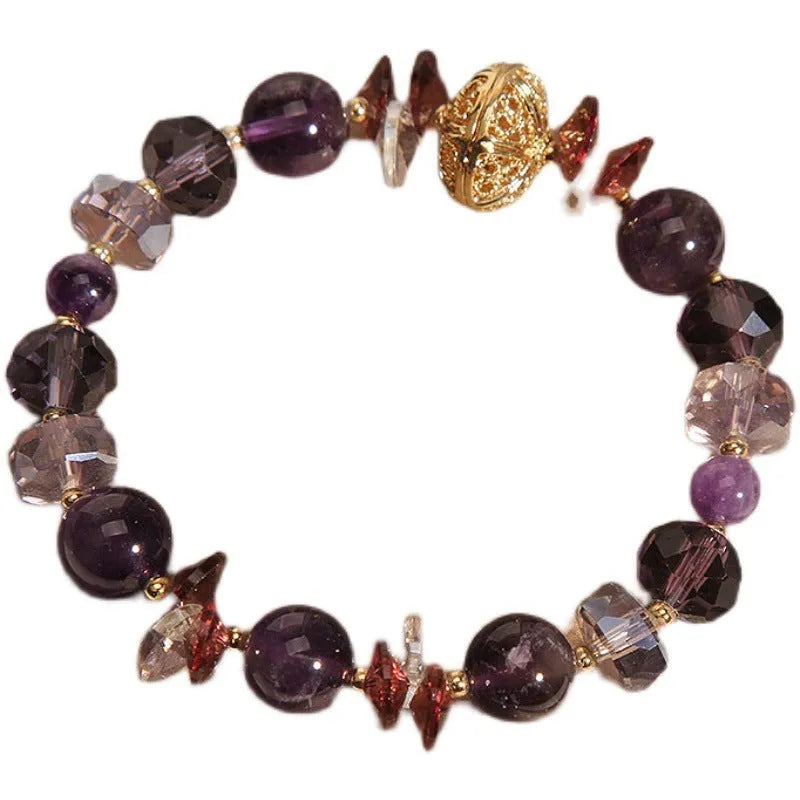 Purple crystal bracelet with pumpkin beads and rhinestone detailing on adjustable band