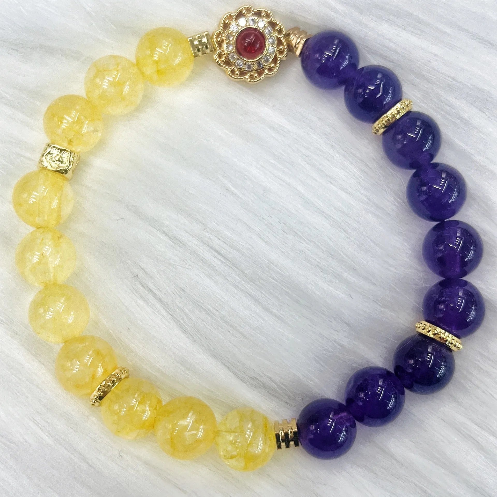 Handmade women's yellow and purple bracelet with amethyst and crystal beads featuring adjustable sliding knot closure