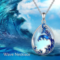 Close-up of a moonstone blue heart-shaped alloy pendant on a necklace chain.