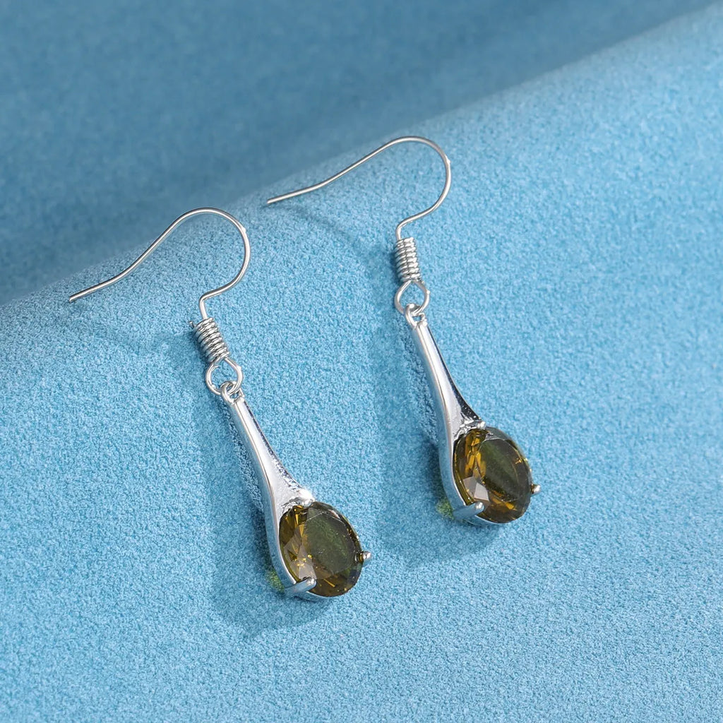 A pair of simple olive green drop-shaped earrings with a retro style on a white background.