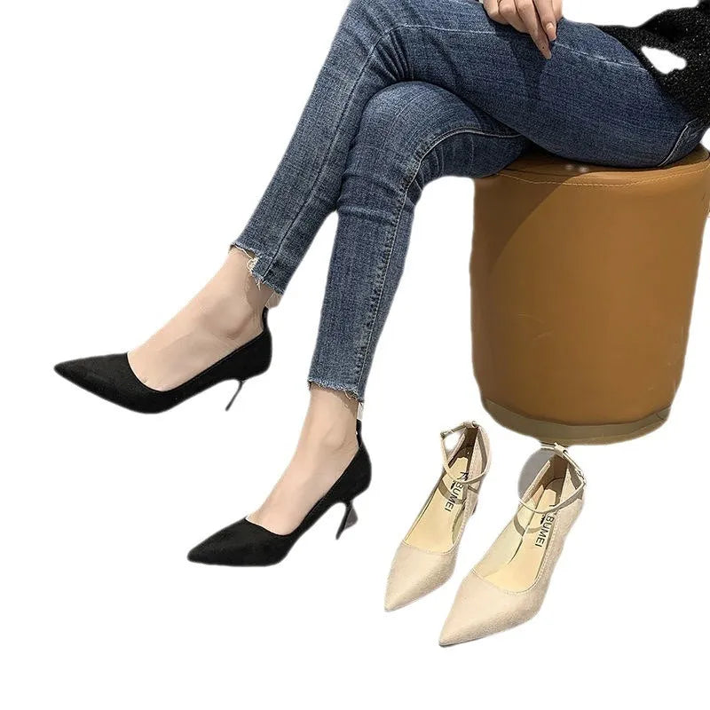 Women's black stiletto heel pump shoes with buckle detail on side