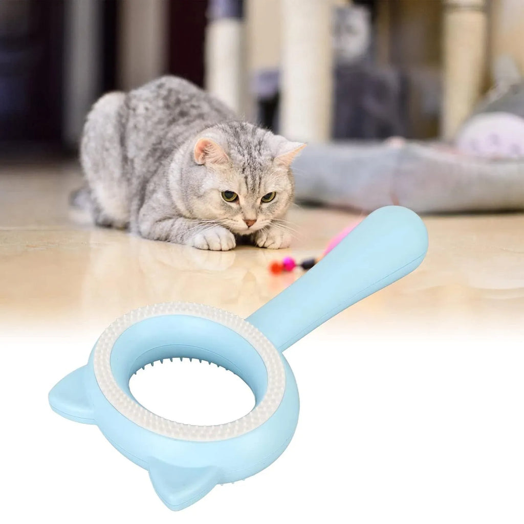 Blue and white double-sided pet grooming brush with ergonomic handle showing quick clean-up feature