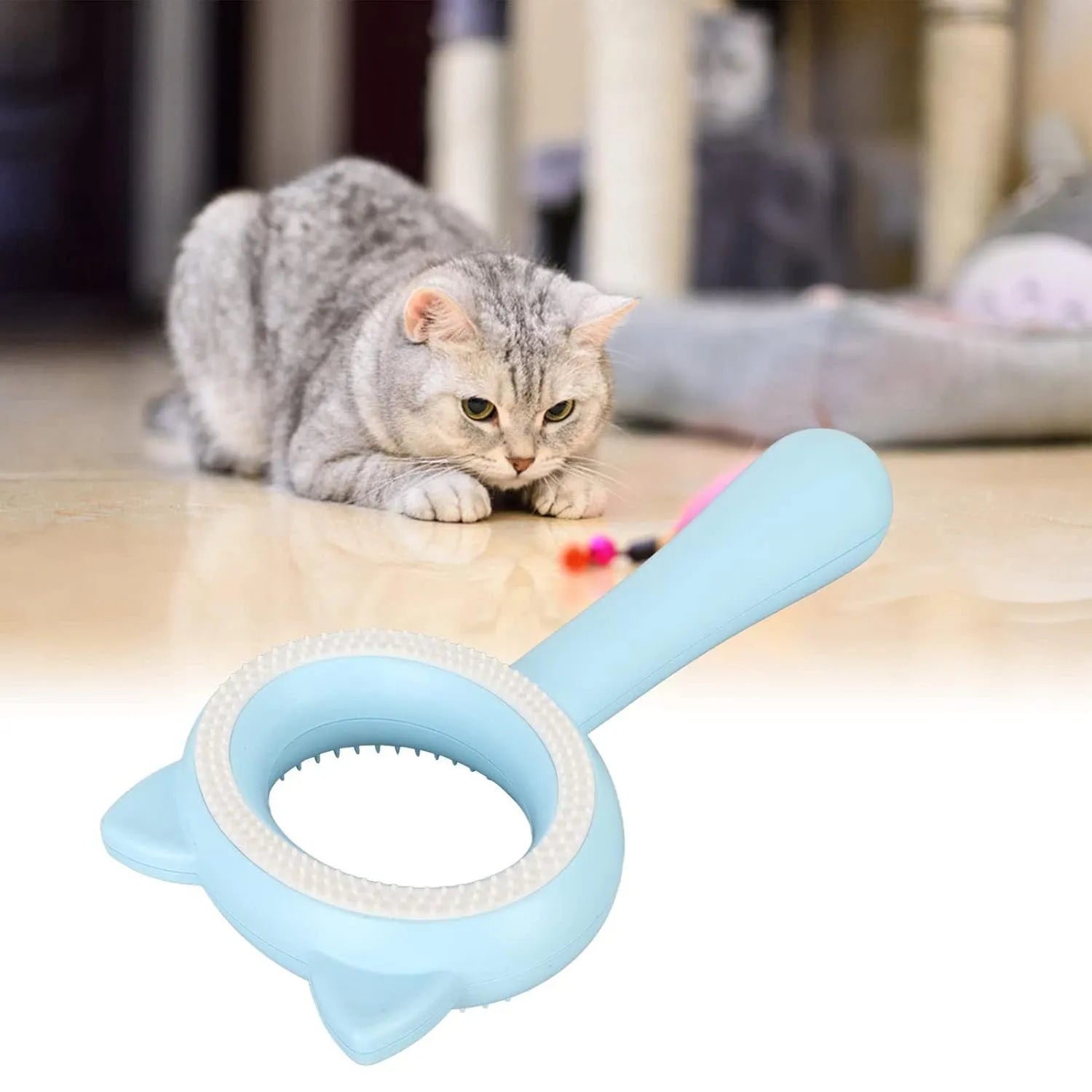 Blue and white double-sided pet grooming brush with ergonomic handle showing quick clean-up feature