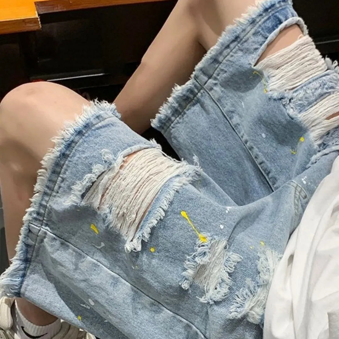 Men's black denim shorts with water-washed hole design and loose street style fit