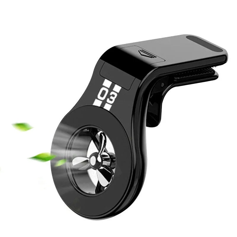 Black magnetic car air vent phone holder with adjustable ball joint and fragrance disc attached.
