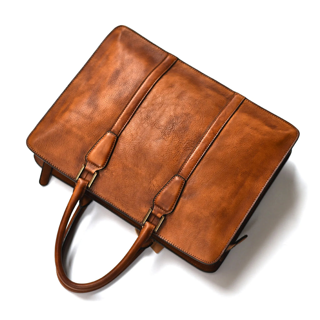 Men's brown leather retro handbag with a horizontal square shape and zipper opening