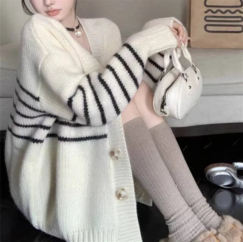 Japanese Korean style cardigan sweater with 3D pattern and button collar on a hanger.