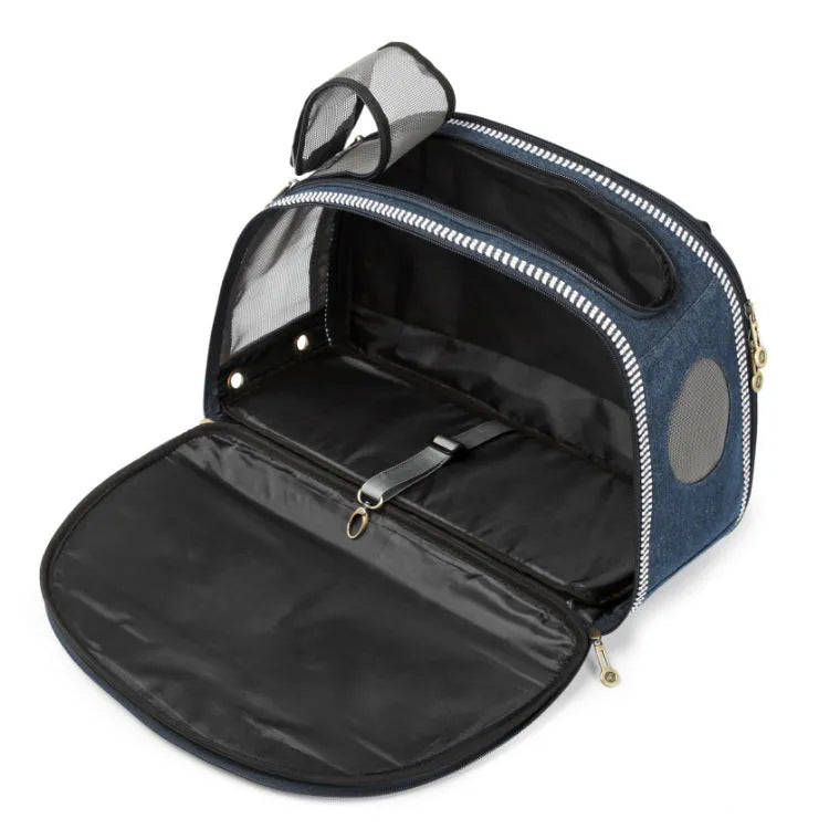 Blue denim pet carrier bag with cartoon pattern, measuring 43cm by 20cm by 30cm.