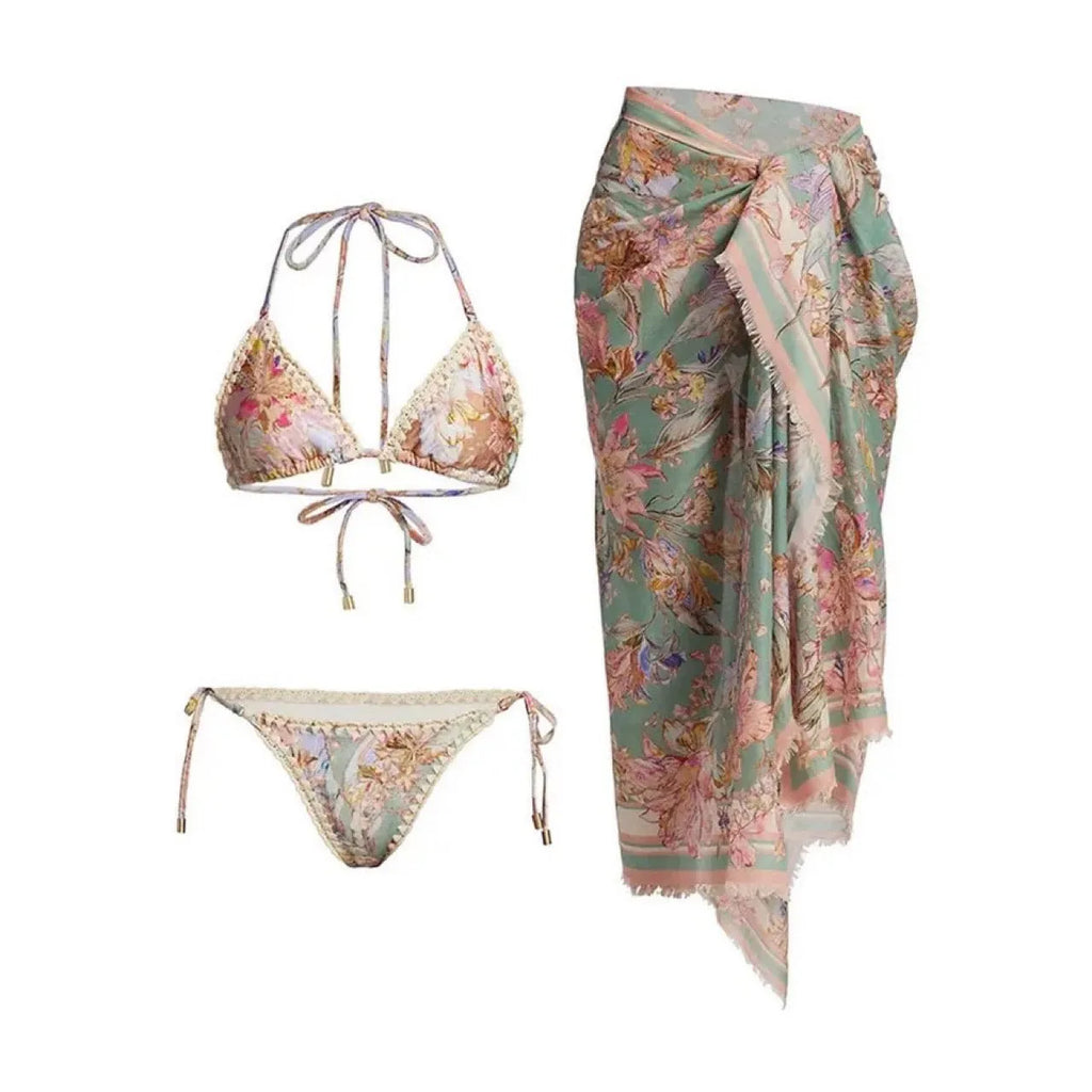 Women's beige floral bikini set with matching skirt on neutral background