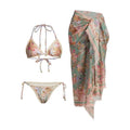 Women's beige floral bikini set with matching skirt on neutral background