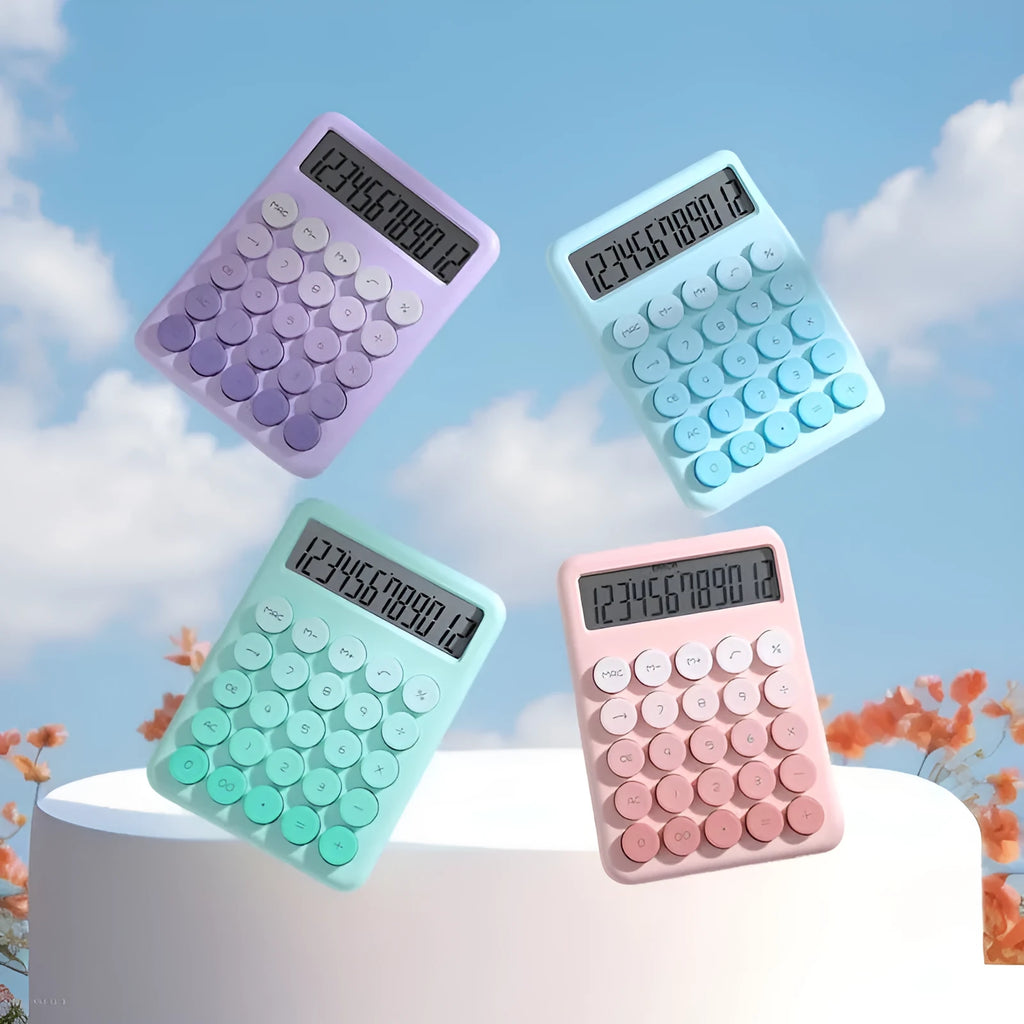 Gradient colour desktop calculator with large keys on a desk, shown in violet, pink, blue, and green colour options.