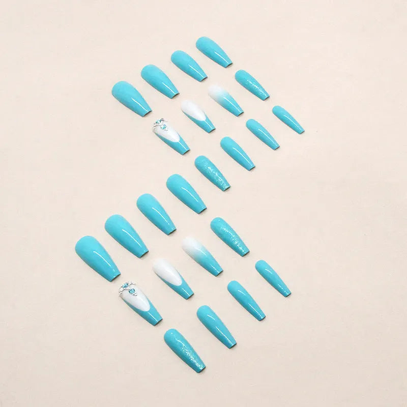 Solid colour artificial nails with long ballet shape and blue diamond glitter decoration