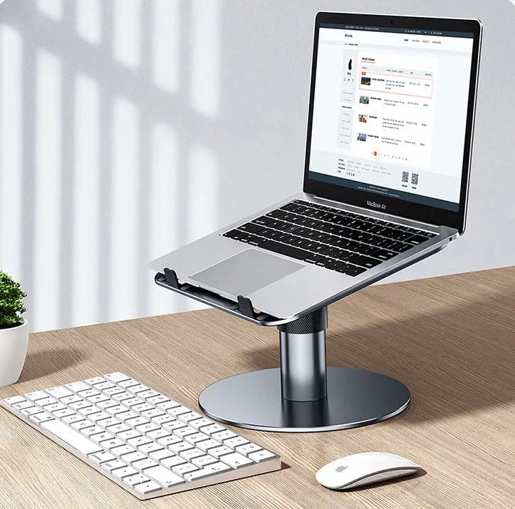 Silver adjustable aluminium car laptop stand with rotating base on a car seat.