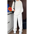 Men's casual two-piece suit with long sleeve polo shirt and trousers in black or apricot colours