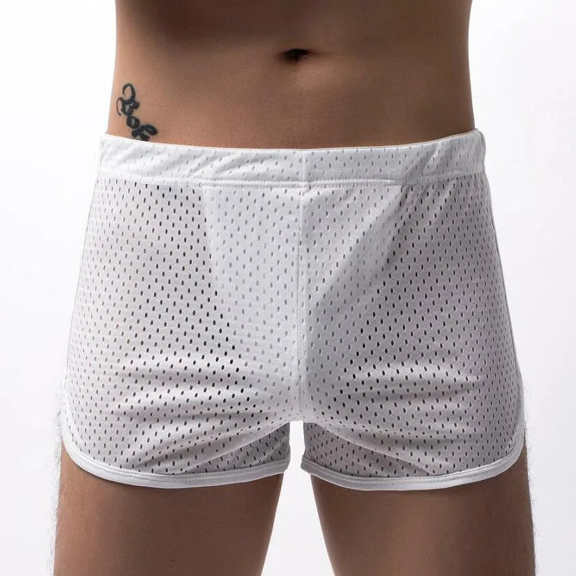 Men's black three-point boxer shorts on a white background showing mid-waist design.