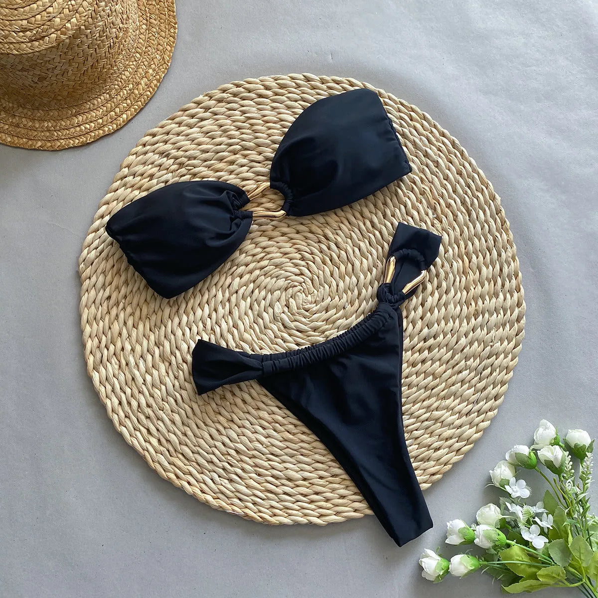 Women's black low waist bikini swimsuit with split briefs design for swimming and fitness activities
