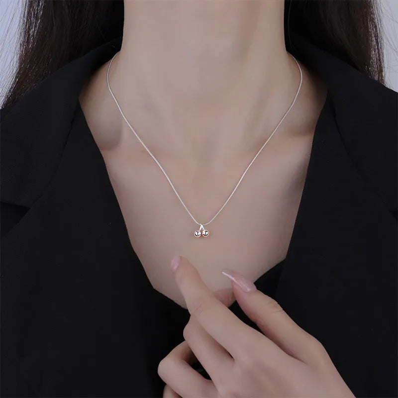 Silver cherry necklace on snake bone chain, adjustable length, Korean style jewellery for women.