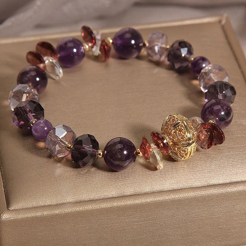 Purple crystal bracelet with pumpkin beads and rhinestone detailing on adjustable band