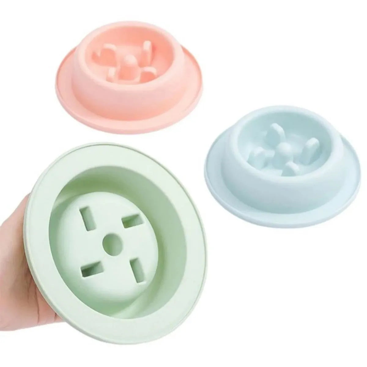Blue pet slow feeder bowl with maze pattern and non-slip base on a kitchen floor