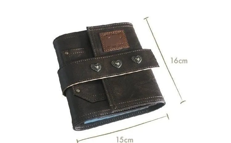 Brown retro-style notebook with a buckle closure and loose-leaf binder binding