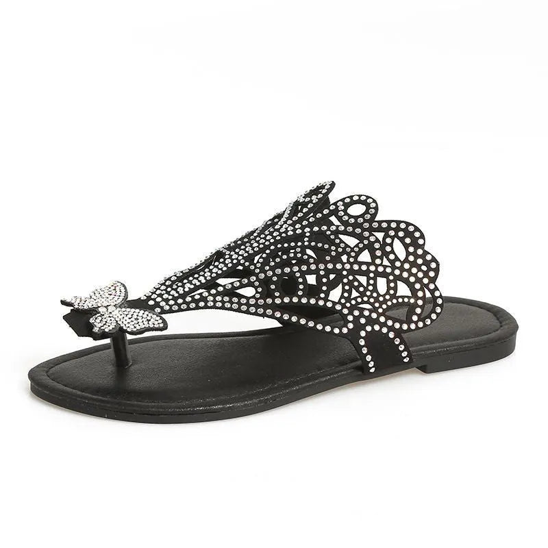 Women's black flip-toe sandals with rhinestone decoration showing slip-on hollow design