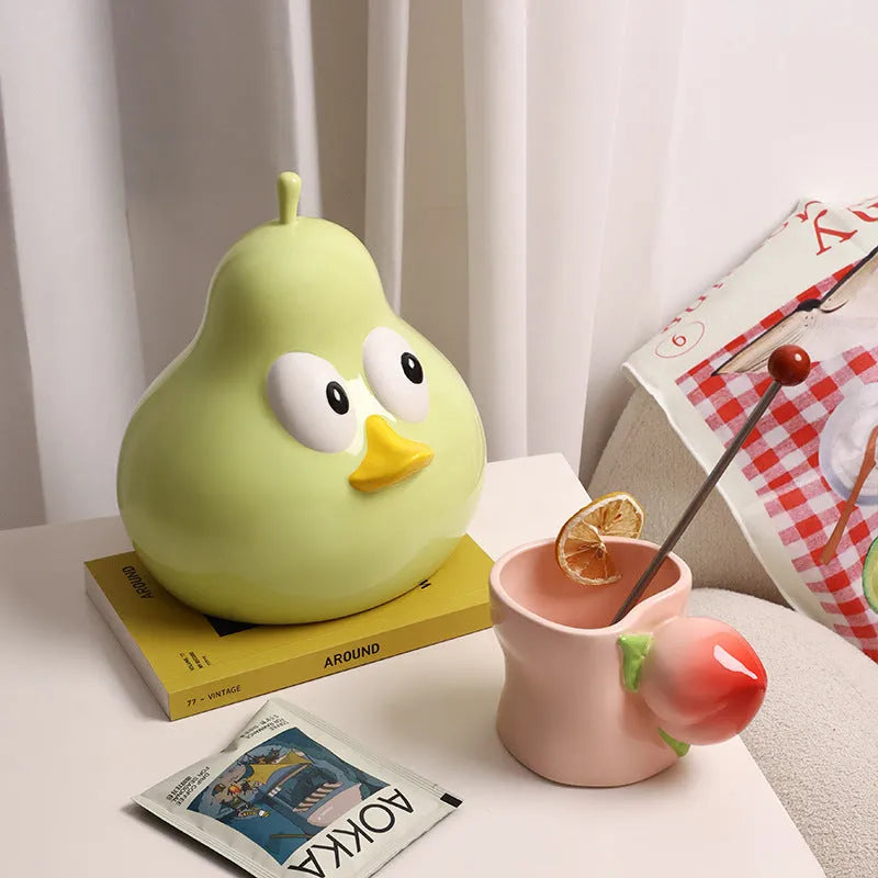 Ceramic pear-shaped tissue box holder in white porcelain with animal design for desktop use
