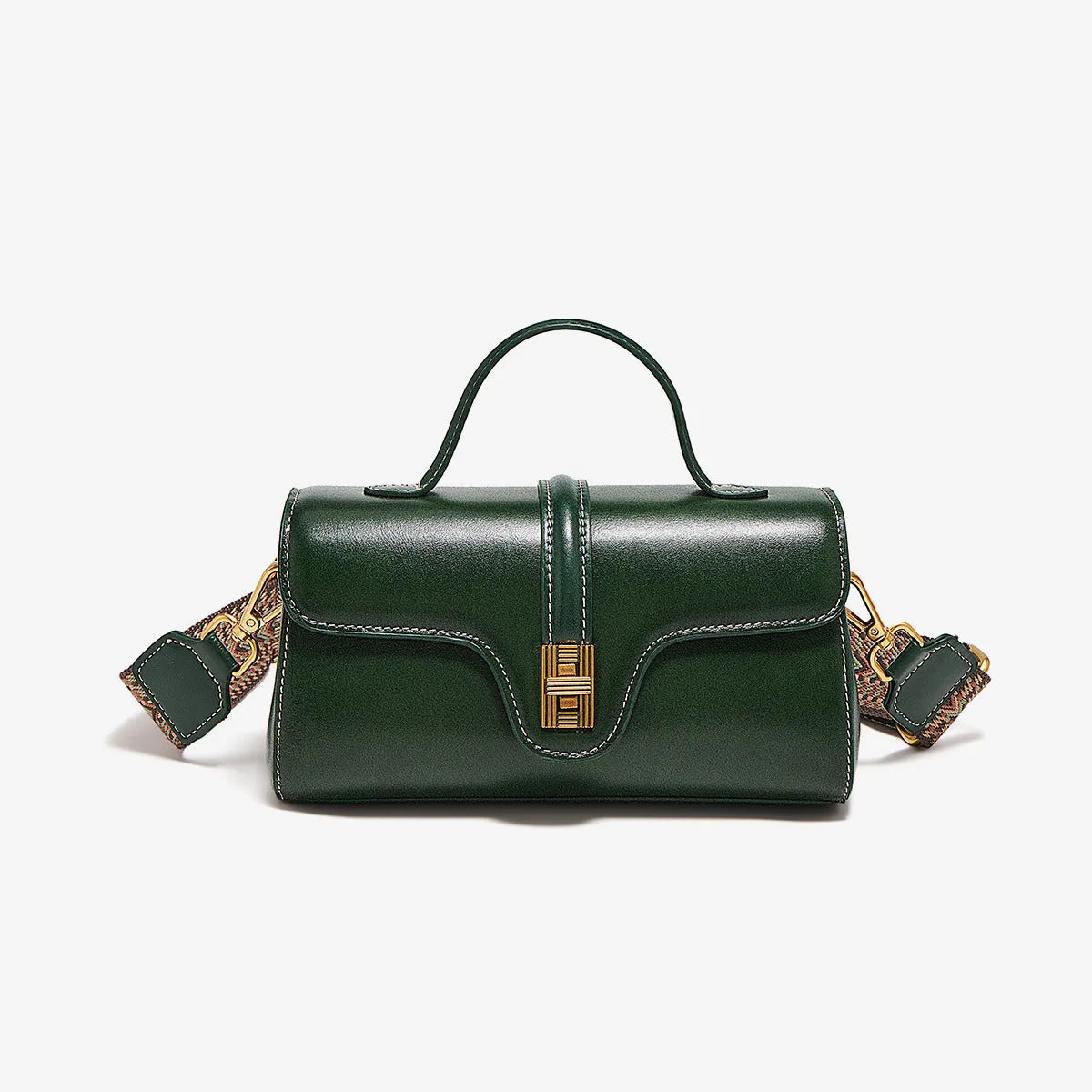 Brown Cambridge-style crossbody messenger bag with clamshell opening and lock detail on a table.