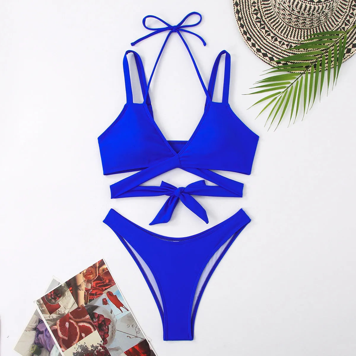 Women's solid colour bikini swimsuit with adjustable straps on a hanger, shown in red.