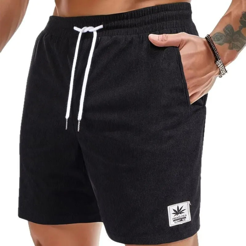 Men's black drawstring summer shorts with straight leg on a mannequin