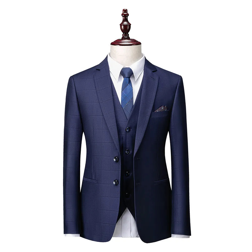 Men's navy blue plaid slim fit three-piece suit with jacket, vest, and trousers on hanger