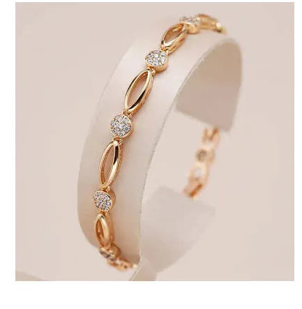 Golden hollow carved copper bracelet with a U-shaped design for women.