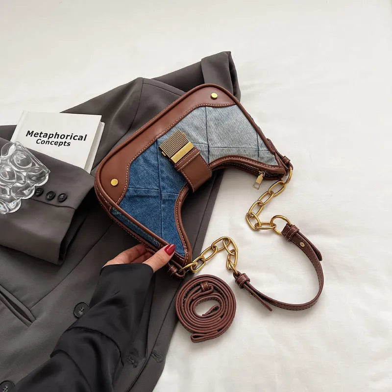 Brown denim women's bucket shoulder bag with diamond mesh, chain detail, and double straps.