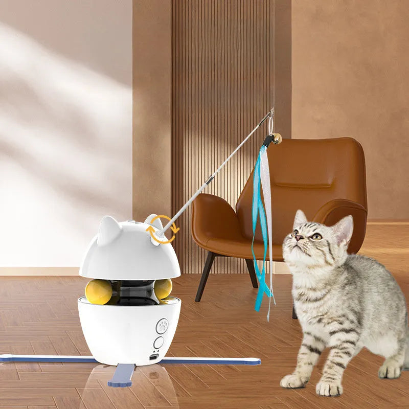 White automatic electronic cat toy with a moving wand, elastic rope, and dangling feathers on a floor.