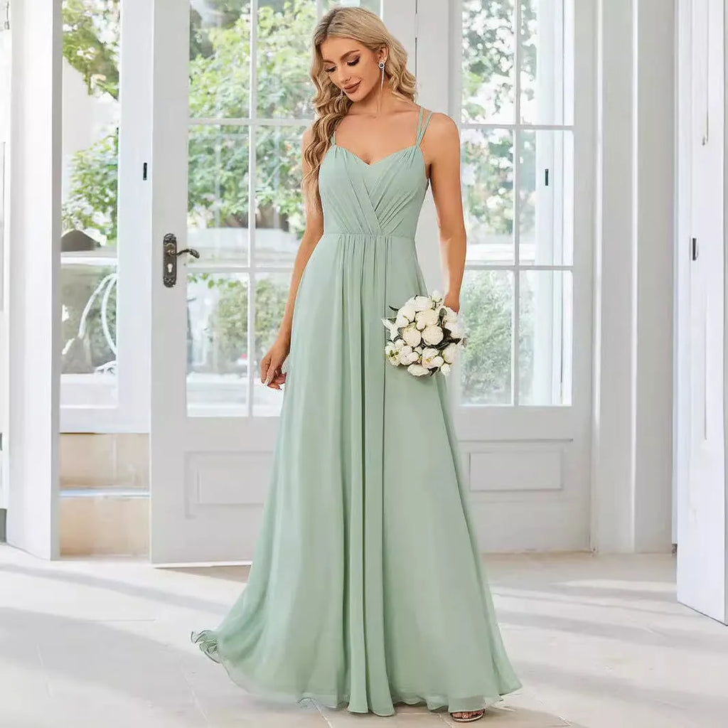 Women's sleeveless long pleated dress in an A-line silhouette, shown in a solid colour.