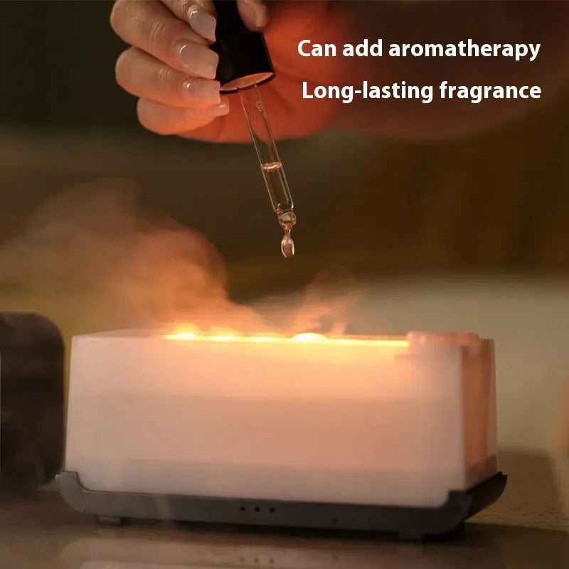 White USB aroma diffuser humidifier with simulated flame and jellyfish smoke ring effects on a table