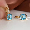 Geometric square ear clip with colourful moissanite inlay on electroplated copper background