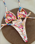 Split bikini set in high-waist Brazilian style, nylon and polyester, available in multiple colours and sizes S M L